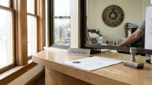 Filing Services counter with official document, rubber stamp, and Texas court seal